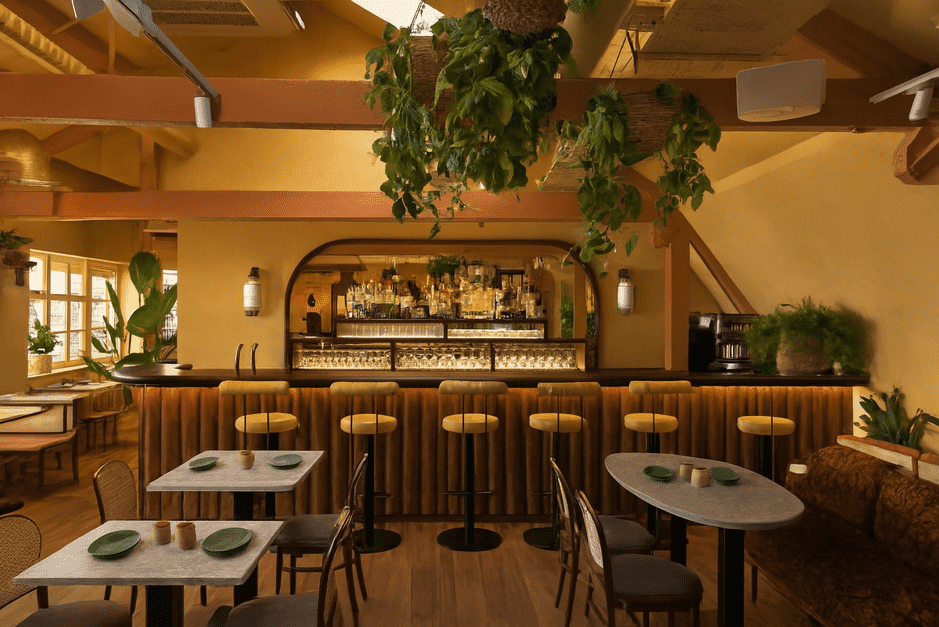Interior of Darjeeling Express, a London restaurant with vibrant decor, serving traditional Indian Mughlai and Calcutta dishes by an all-women kitchen team.