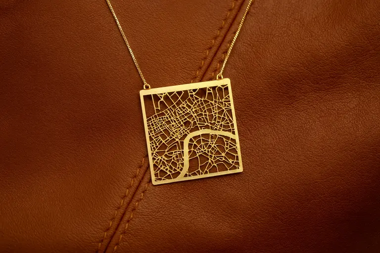 A handcrafted Talia Sari necklace shaped like a city map.
