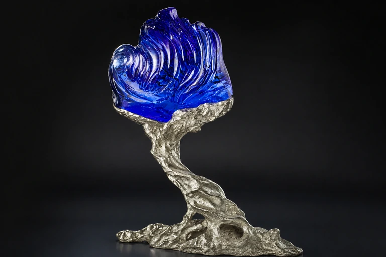 A stunning 703-carat tanzanite sculpture illustrating Naomi Sarna Gemstone Carving mastery.