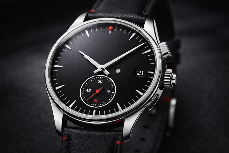 A high-end Leica ZM 1 watch showing its unique shutter-button crown.
