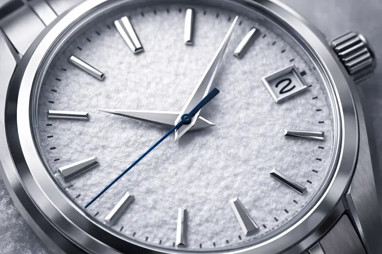 A close-up of a Grand Seiko Snowflake dial representing the Grand Seiko business model.